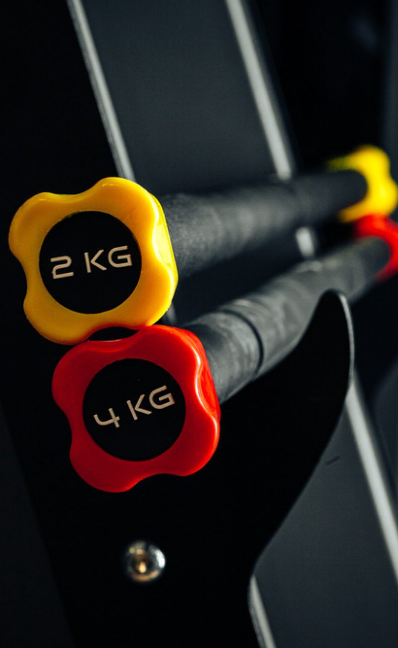 sports-equipment-in-gym-dumbbells-of-different-wei-H53VK59.jpg